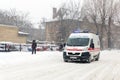 Kiev, Ukraine - March 1, 2018. Heavy snowfalls , frost and blizzard in Eastern Europe. Traffic jam. Ambulance hurrying to rescue t Royalty Free Stock Photo