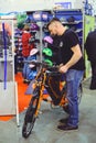 Man looks electric bike modern technology and environmental protection on the streets of the city sale