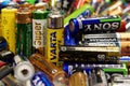 Many multi-colored used batteries from various manufacturers