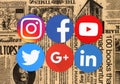 Popular round social media icons on retro newspaper