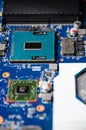 Kiev, Ukraine - March 16, 2021. Selective focus laptop motherboard with Intel processor, coprocessor, video memory. Fixing the Royalty Free Stock Photo
