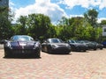 Kiev, Ukraine - May 14, 2011: Black supercars Ferrari 599 GTB Fiorano and Porsche 911 Turbo Gemballa Avalanche GTR 800 EVO-R and