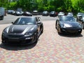 Kiev, Ukraine - May 14, 2011: Black supercars Porsche 911 997 Turbo TechArt GT Street and Porsche 911 Turbo Gemballa Avalanche