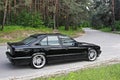 Kiev, Ukraine. May 17, 2014. BMW M5 E34 against the background of the forest Royalty Free Stock Photo