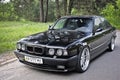 Kiev, Ukraine. May 17, 2014. BMW M5 E34 against the background of the forest Royalty Free Stock Photo