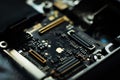 Kiev, Ukraine - May 6, 2019: Close-up image of the central board of the apple iphone se. Golden Apple. Service repair