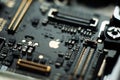 Kiev, Ukraine - May 6, 2020: Close-up image of the central board of the apple iphone se. Golden Apple. Service repair