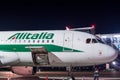 KIEV, UKRAINE - MAY 2: Close view of Alitalia aircraft fuselage near the entering baggage door, at night. May 2, 2017. Royalty Free Stock Photo