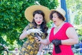 Kiev, Ukraine - May 12, 2018: Girls in vintage dresses on a retro bike