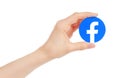 Hand holds new Facebook logo