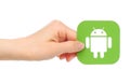 Hands holds Google Android icon