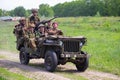 Kiev, Ukraine - May 09, 2018: Men in the uniform of American and British soldiers on a jeep during historical reconstruction