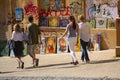 Kiev, Ukraine - May 19, 2019: People pass near paintings sold by artists on Andrew Descent