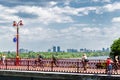 Kiev, Ukraine - May 2018. People are walking on the pedestrian bridge on a spring day.