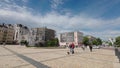 Kiev, Ukraine - May 26, 2022: People walking for their business near Bogdan Khmelnitsky Statue on Sofiyivska square in Kiev.