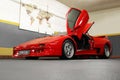 Kiev, Ukraine - May 22, 2021: Red luxury supercar Lamborghini Diablo Koenig with open door. Exclusive red supercar in the Royalty Free Stock Photo