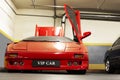 Kiev, Ukraine - May 22, 2021: Red luxury supercar Lamborghini Diablo Koenig with open door. Exclusive red supercar in the Royalty Free Stock Photo