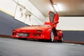 Kiev, Ukraine - May 22, 2021: Red luxury supercar Lamborghini Diablo Koenig with open door. Exclusive red supercar