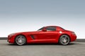 Kiev, Ukraine - May 19, 2020: Red supercar Mercedes-Benz SLS AMG against the sky. Wallpaper. Car in motion