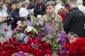Kiev, Ukraine - May 9, 2019: Student in uniform lays flowers at the monument to the fallen soldiers