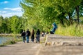 KIEV, Ukraine -May 09,2020: A teenage girl with blue hair is sitting by the waterfront