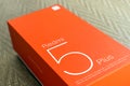 KIEV, UKRAINE - MAY 28, 2018: Xiaomi Redmi 5 Plus black new smartphone with orange box close up developed by Xiaomi Inc. Xiaomi i Royalty Free Stock Photo