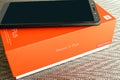 KIEV, UKRAINE - MAY 28, 2018: Xiaomi Redmi 5 Plus black new smartphone with orange box close up developed by Xiaomi Inc. Xiaomi i Royalty Free Stock Photo