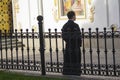 Kiev, Ukraine - May 18, 2019: Young priest during prayers at thePechersk Lavra