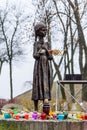 Kiev, Ukraine - November 25, 2017: Bronze statue of the hungry girl. Monument to Victims of Famine in 1932 - 1933