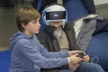 Kiev, Ukraine - 08 October 2017: Children get acquainted with the points of virtual finality at the exhibition of consumer electro Royalty Free Stock Photo