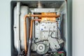 View of the disassembled gas water heater boiler for home heating. Installation, connection and maintenance concept