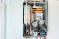 View of the disassembled gas water heater boiler for home heating. Installation, connection and maintenance concept