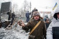 KIEV, UKRAINE: Protester in winter hat show grenad