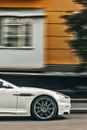 Kiev, Ukraine - September 2, 2017: Aston Martin DBS, white British supercar in the city. Car in motion