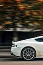 Kiev, Ukraine - September 2, 2017: Aston Martin DBS, white British supercar in the city. Car in motion