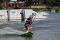 an athlete trains and shows tricks on the water while doing sports wakeboarding