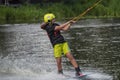 an athlete trains and shows tricks on the water while doing sports wakeboarding