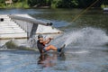 an athlete trains and shows tricks on the water while doing sports wakeboarding