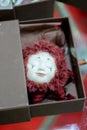 KIEV, Ukraine - September 06 ,2020: Author`s doll made in the technique of realism. Keychain face in the shape of the sun