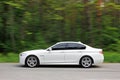 Kiev, Ukraine; September 20, 2014, BMW 520 TDI F10 M Sport in the forest Royalty Free Stock Photo