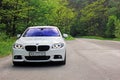 Kiev, Ukraine; September 20, 2014, BMW 520 TDI F10 M Sport in the forest Royalty Free Stock Photo