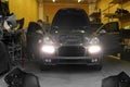 Kiev, Ukraine - September 2, 2016: Car service. Masters in the garage repair Porsche Cayenne