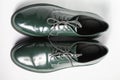KIEV, UKRAINE - September 18, 2019: Fashionable men`s green brogues by Geoks Respira company with airing technology. Royalty Free Stock Photo