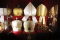 Headdresses of priests on a red background