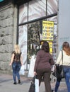 Kiev, Ukraine - September 11, 2013: Passers-by looking at the billboard with the exchange rate