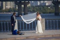 Kiev, Ukraine - September 18, 2015: Photographer working with the newlyweds