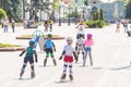 Kiev, Ukraine the 8th of July - A group of children in sport equipment with instructor doing rollerskating exercises in Mariinsky