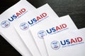 Kiev, Ukraine - 02 12 2023: USAid logo on paper, USAid is USA agency for international development - assistance abroad, closeup Royalty Free Stock Photo