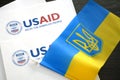 Kiev, Ukraine - 02 12 2023: USAid logo and ukrainian flag, USAid is USA agency for international development - assistance abroad, Royalty Free Stock Photo