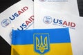 Kiev, Ukraine - 02 12 2023: USAid logo and ukrainian flag, USAid is USA agency for international development - assistance abroad Royalty Free Stock Photo